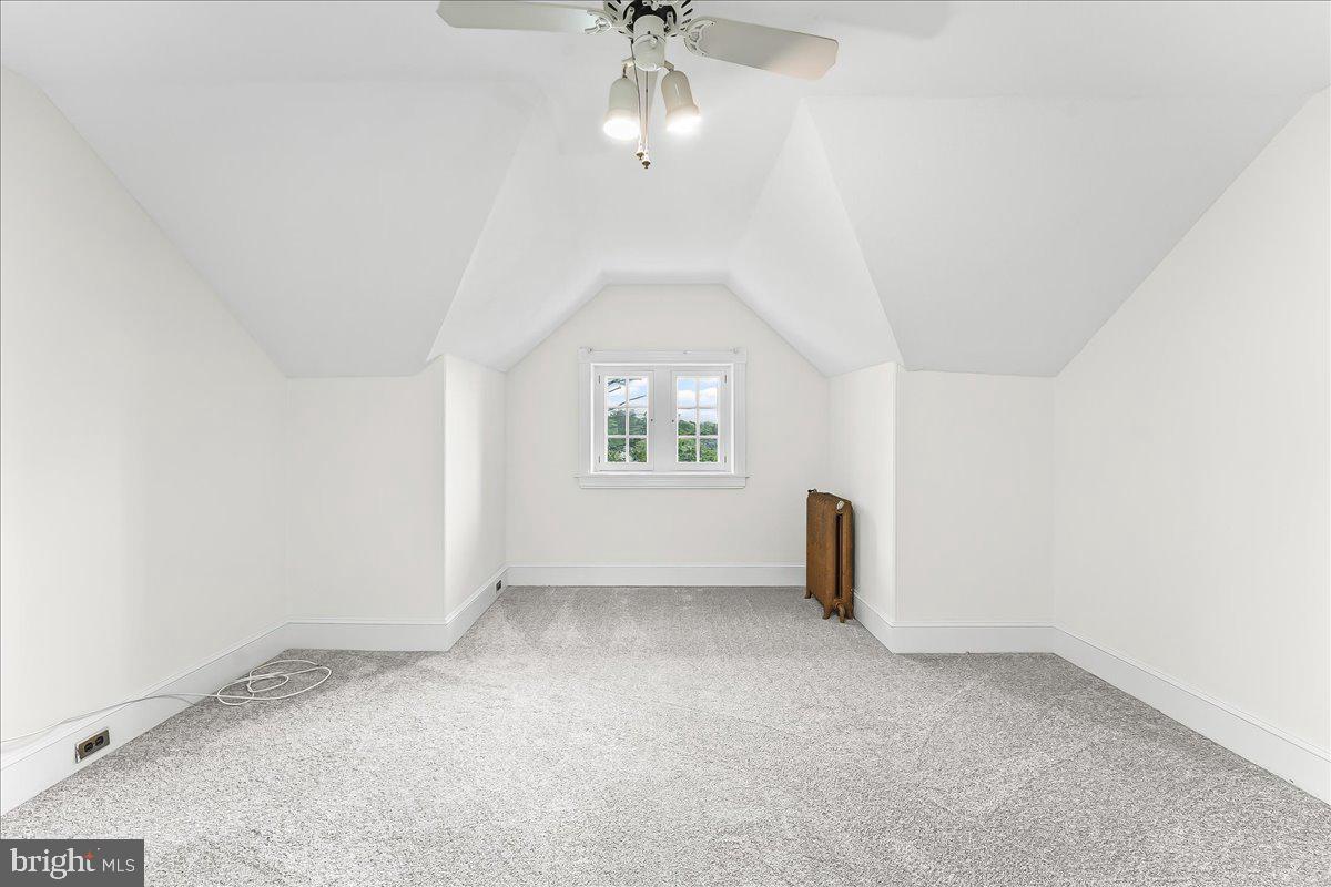 503 West State Street Kennett Square, PA 19348 - Photo 46 of 76 an empty room with windows and chandelier fan