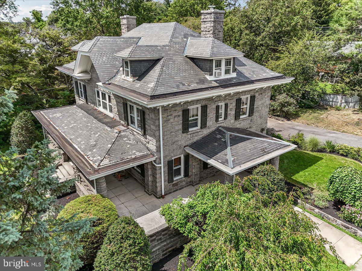 503 West State Street Kennett Square, PA 19348 - Photo 57 of 76 an aerial view of a house with a yard table and chairs