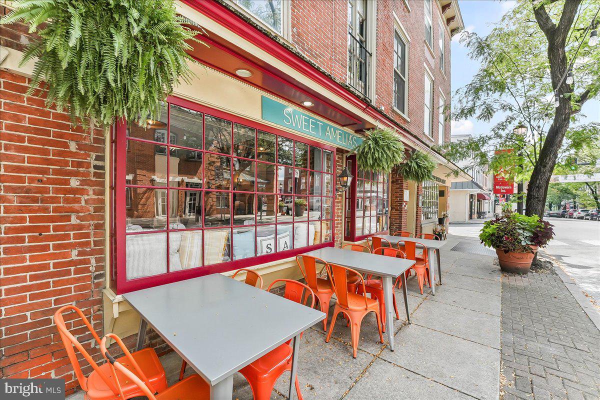 503 West State Street Kennett Square, PA 19348 - Photo 62 of 76 a building outdoor space with patio furniture and potted plants