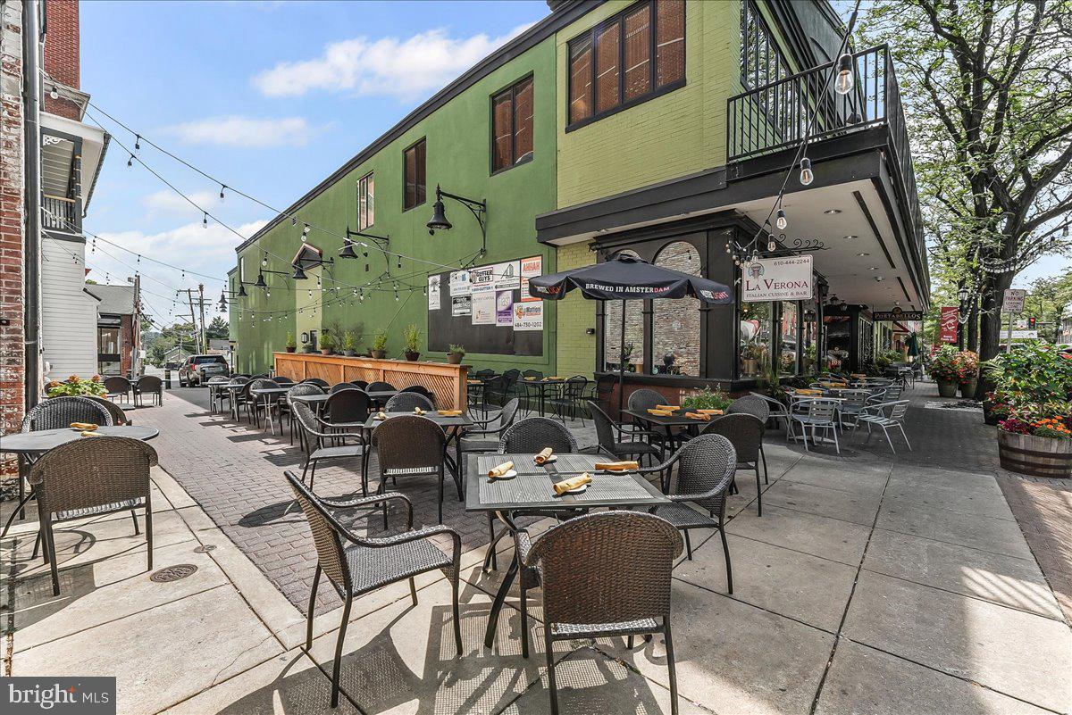 503 West State Street Kennett Square, PA 19348 - Photo 64 of 76 a view of a patio with couches table and chairs and potted plants