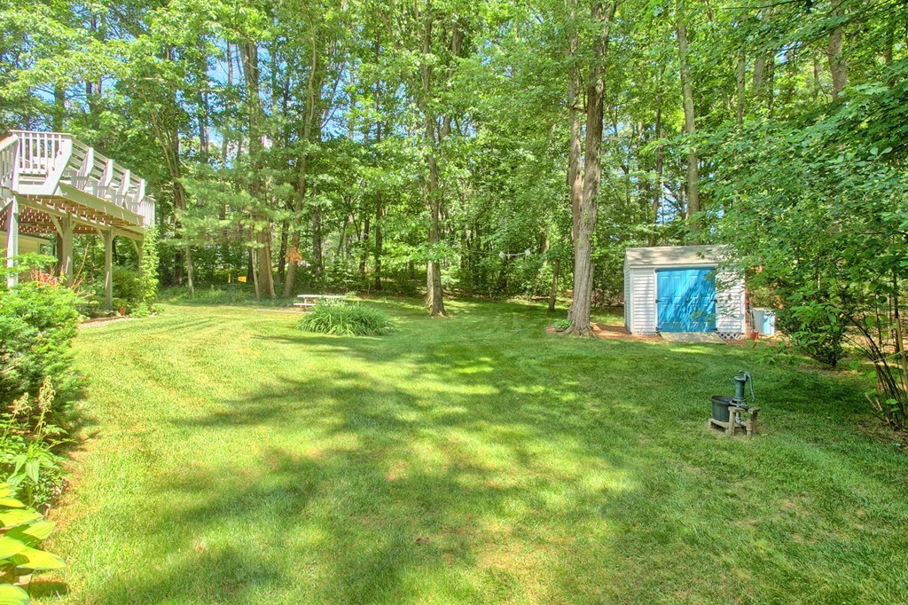 130 Ferncroft Road Tewksbury, MA 01876 - Photo 28 of 29 a backyard of a house with table and chairs