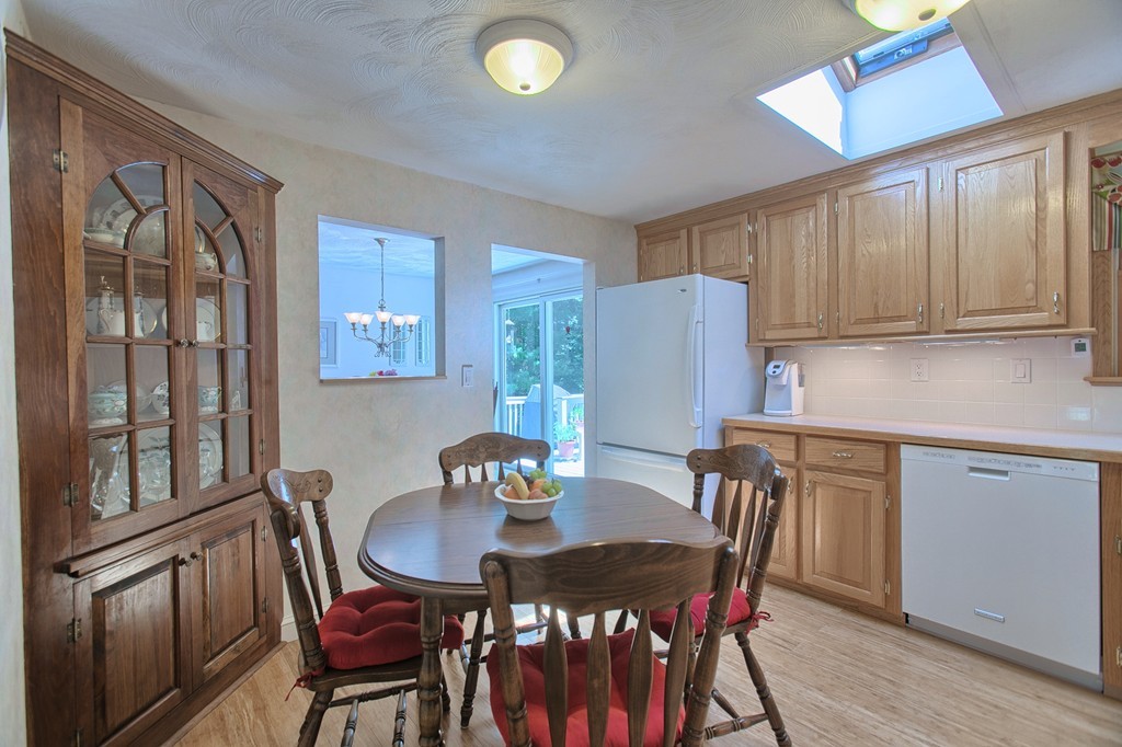 130 Ferncroft Road Tewksbury, MA 01876 - Photo 8 of 29 a view of a dining room with furniture window and wooden floor