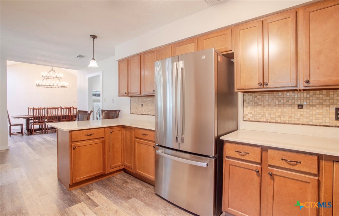 188 Cavalry Road Victoria, TX 77905 - Photo 16 of 30 a kitchen with stainless steel appliances a refrigerator sink and cabinets