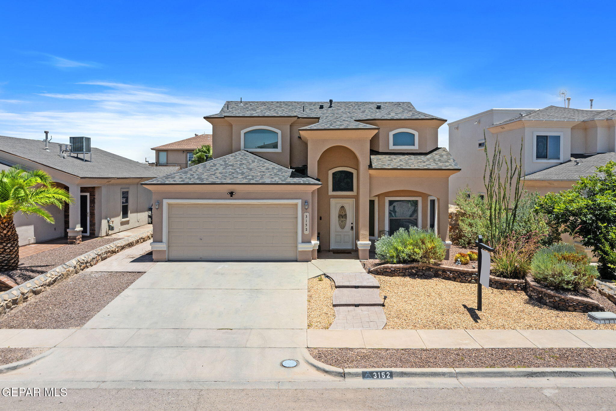 3152 Rustic Hidden Drive El Paso, TX 79938 - Photo 1 of 38 a front view of a house with yard