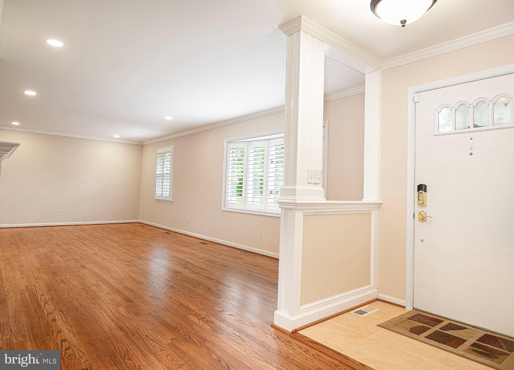 14300 Carroll Ridge Court Baldwin, MD 21013 - Photo 15 of 73 a view of an empty room with wooden floor and a window