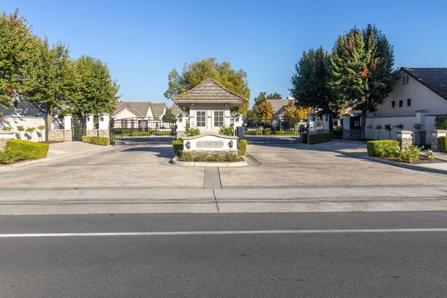 a view of a yard with cars