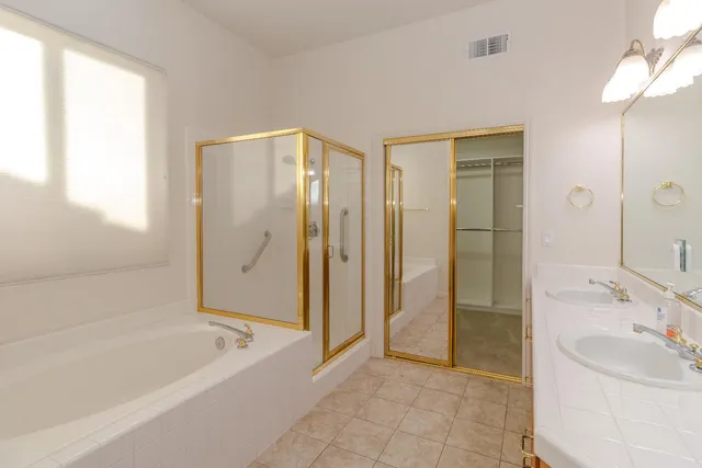 a bathroom with a bathtub and a sink