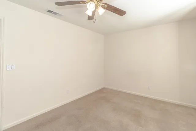 a view of a small space with a fan