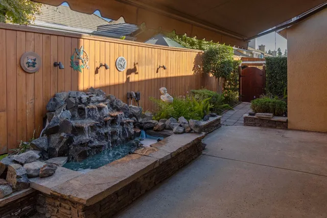 a wooden bench sitting in front of a building