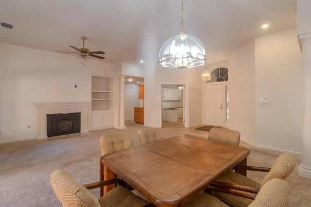 a view of a livingroom with furniture and chandelier