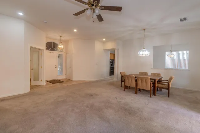 a view of a livingroom with furniture and a window