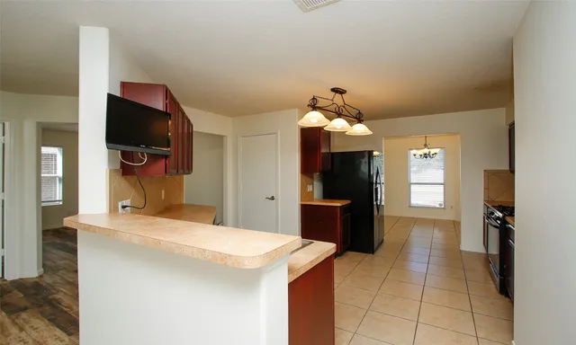 a kitchen with a sink and refrigerator