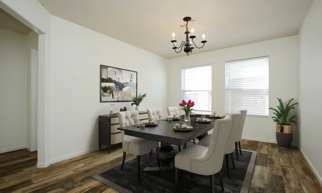 a view of a dining room with furniture window and wooden floor