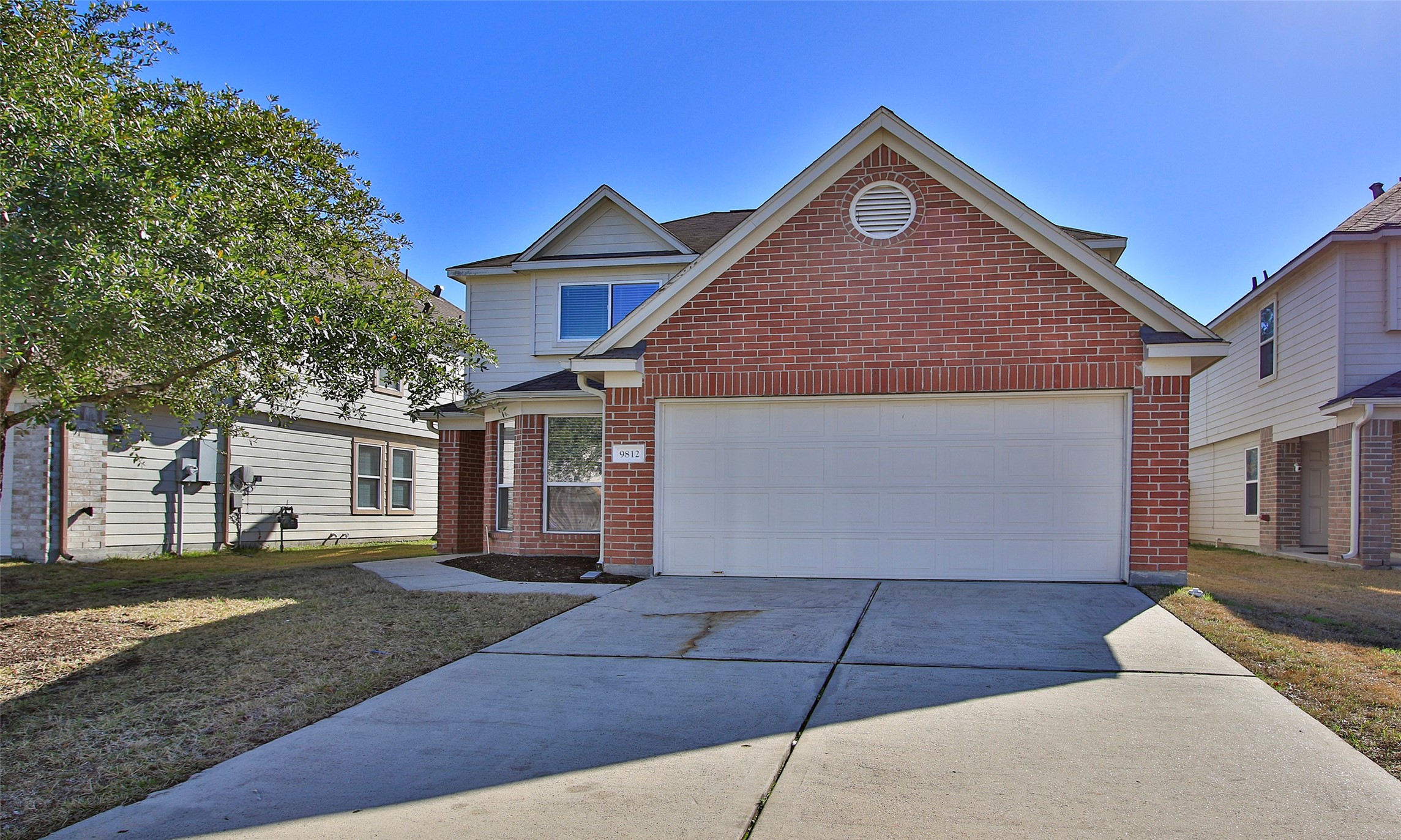 9812 Expedition Trail Conroe, TX 77385 - Photo 2 of 37 a front view of a house with a yard and garage