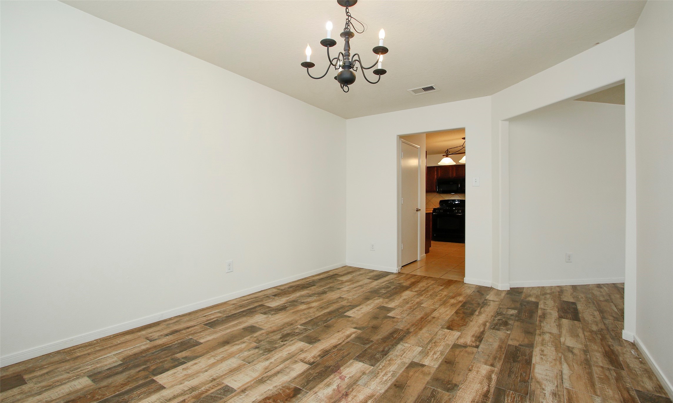 9812 Expedition Trail Conroe, TX 77385 - Photo 22 of 37 a view of a livingroom with a chandelier