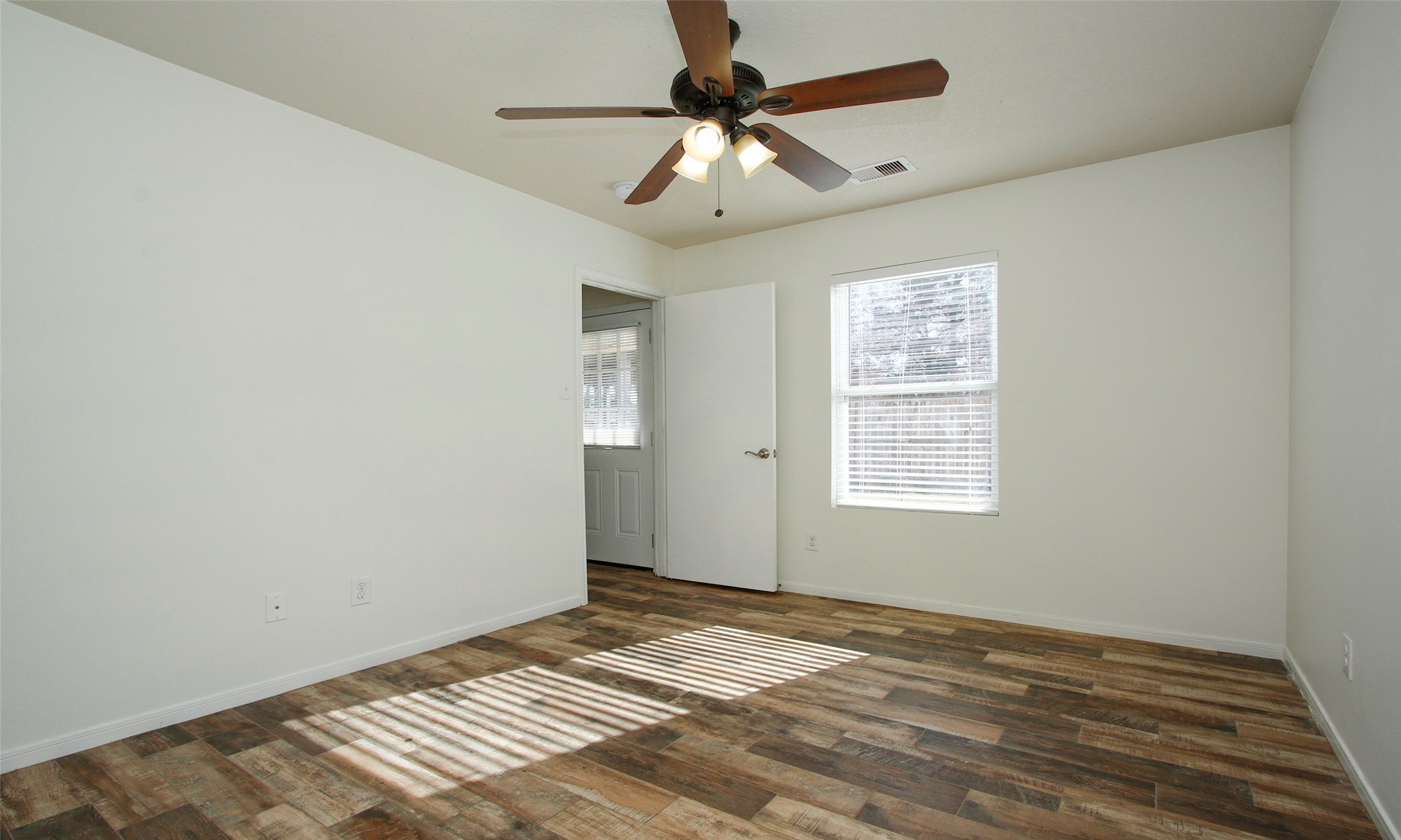 9812 Expedition Trail Conroe, TX 77385 - Photo 24 of 37 a view of an empty room with a window