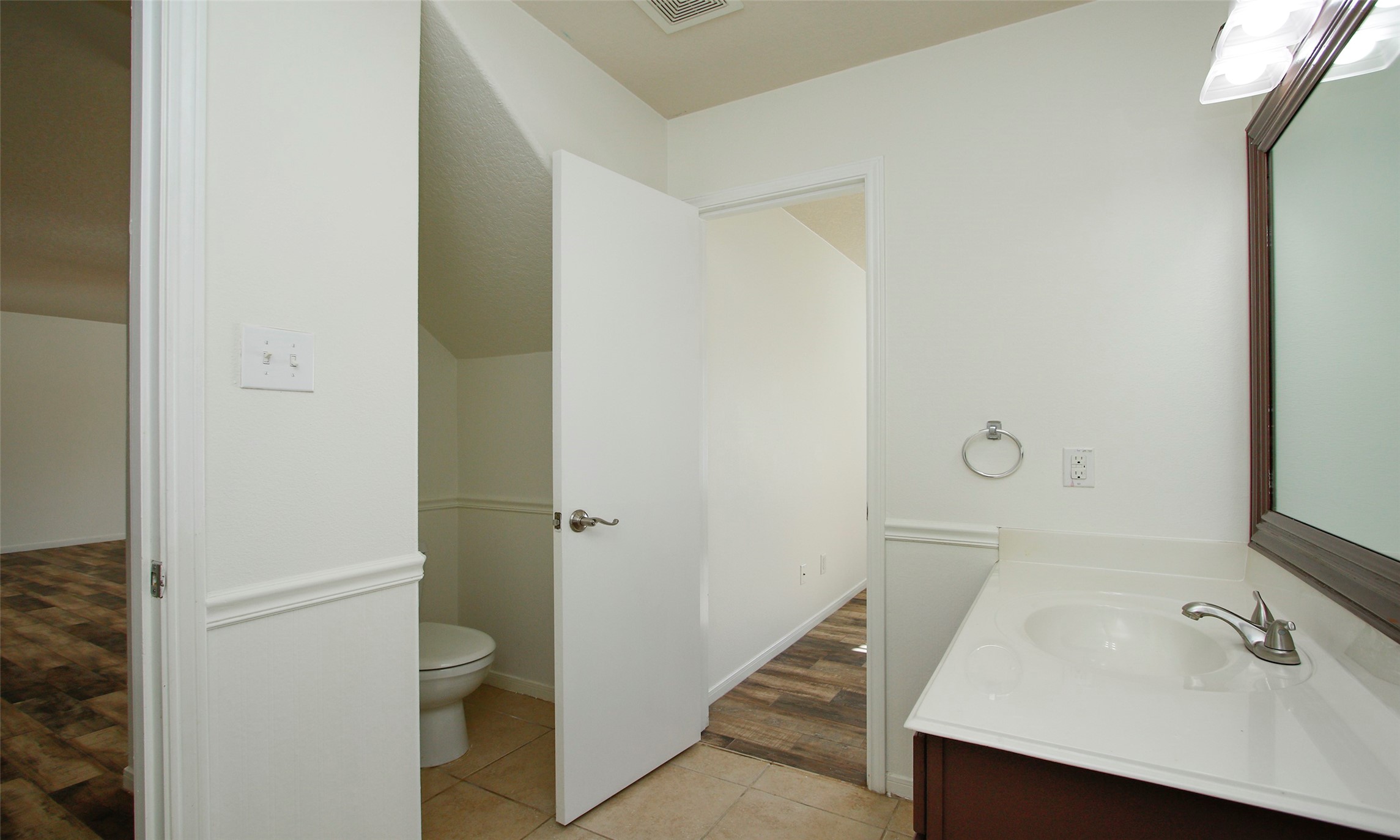 9812 Expedition Trail Conroe, TX 77385 - Photo 27 of 37 a bathroom with a sink and mirror with toilet