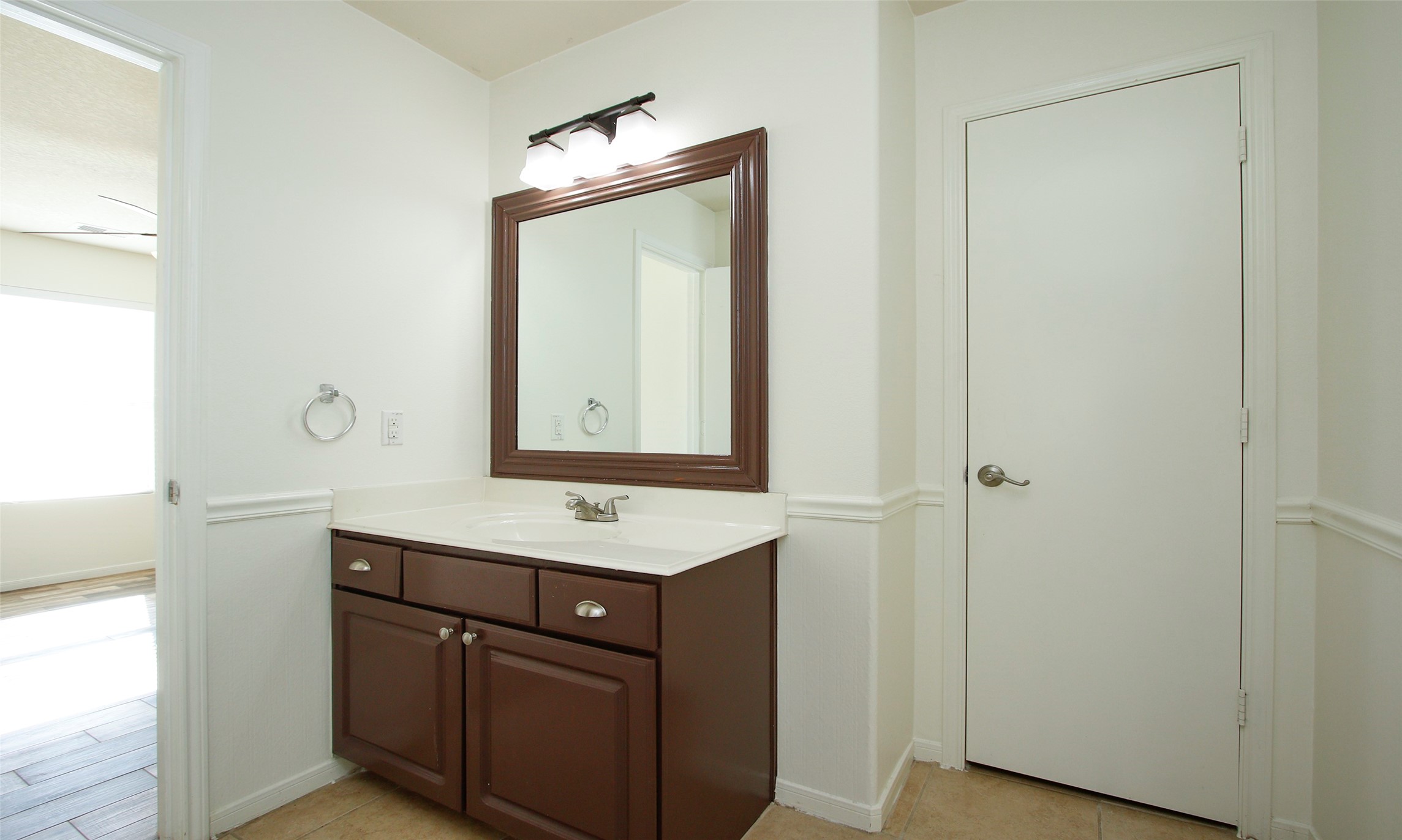 9812 Expedition Trail Conroe, TX 77385 - Photo 28 of 37 a bathroom with a sink a vanity and a mirror