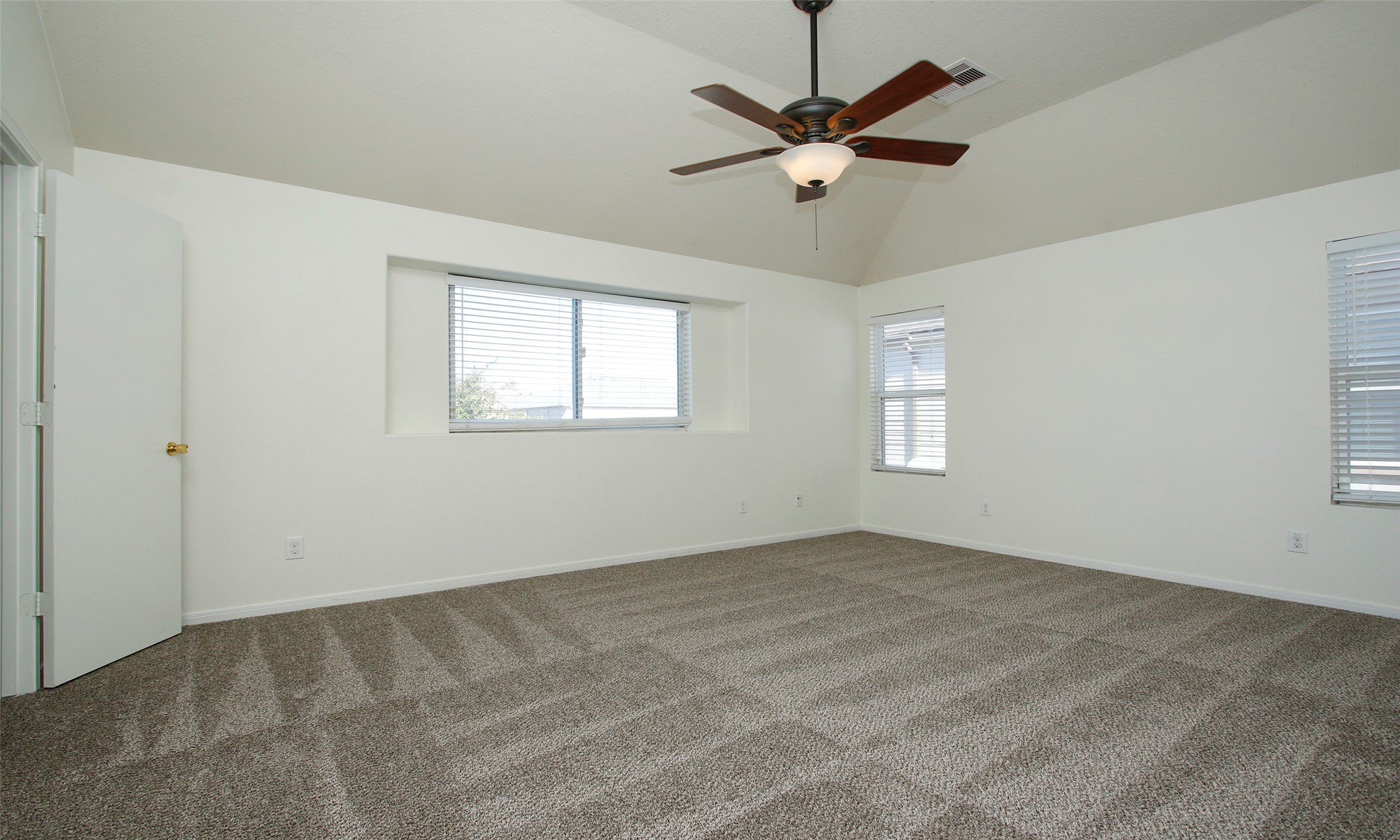 9812 Expedition Trail Conroe, TX 77385 - Photo 29 of 37 an empty room with a window and a fan