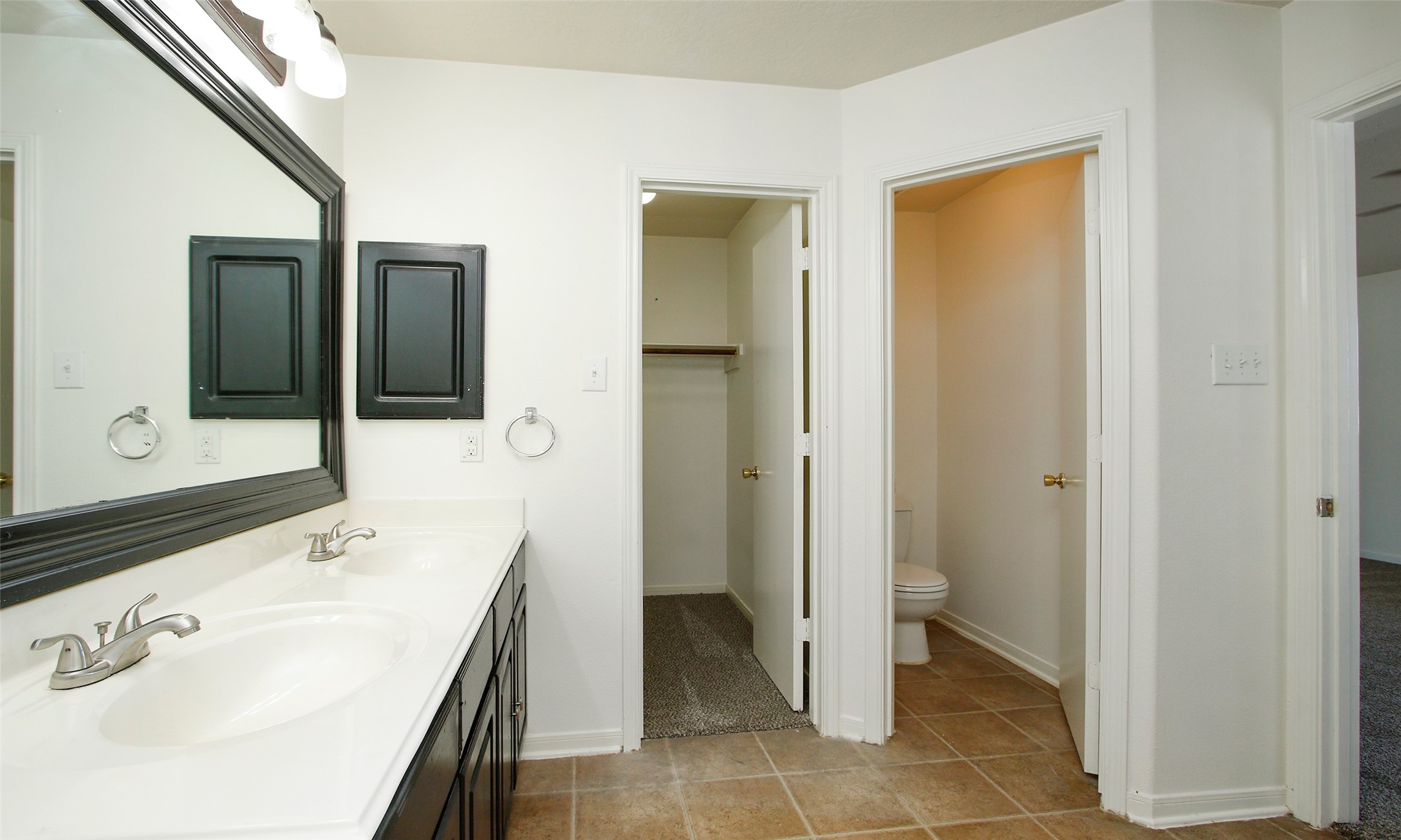 9812 Expedition Trail Conroe, TX 77385 - Photo 35 of 37 a spacious bathroom with a sink and a mirror
