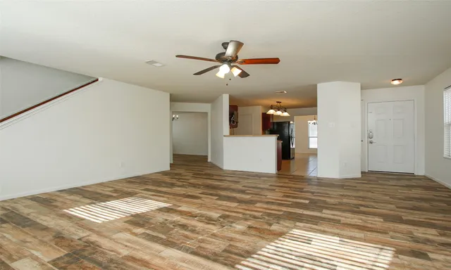 a view of a room with a kitchen