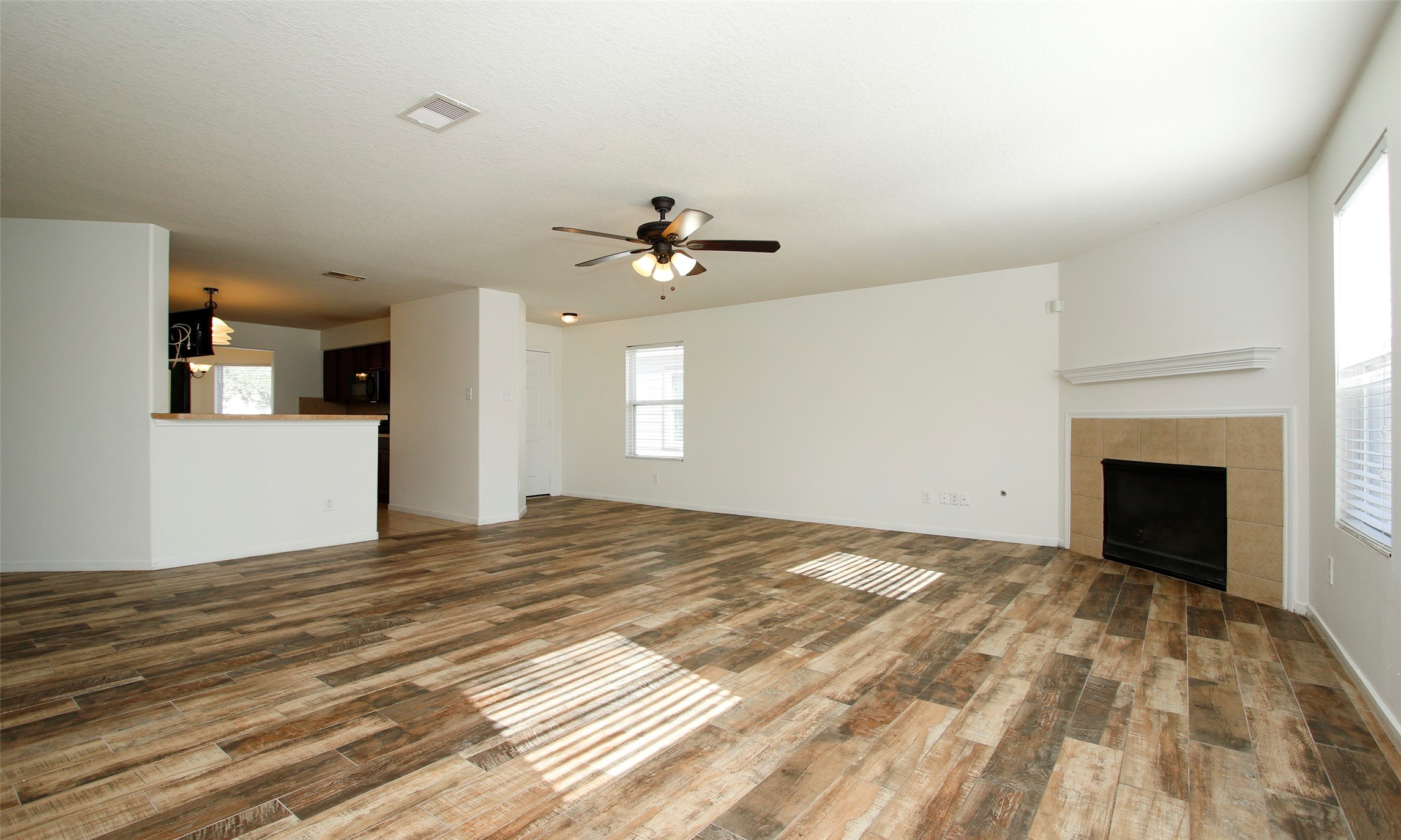 9812 Expedition Trail Conroe, TX 77385 - Photo 9 of 37 a view of a livingroom with a fireplace