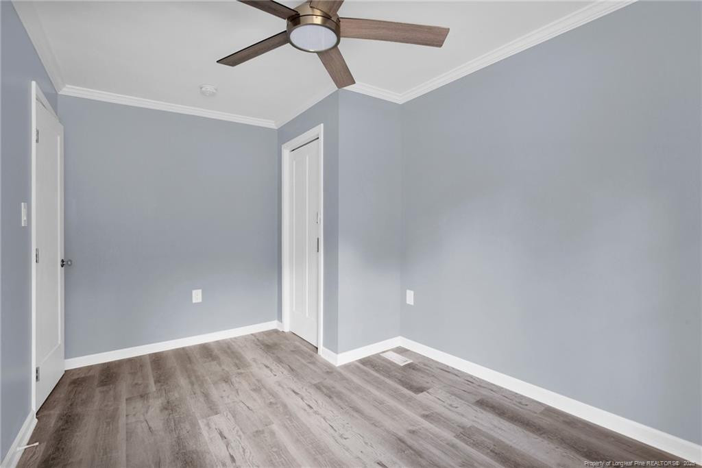 266 Brower Road Cameron, NC 28326 - Photo 17 of 26 a view of empty room with wooden floor