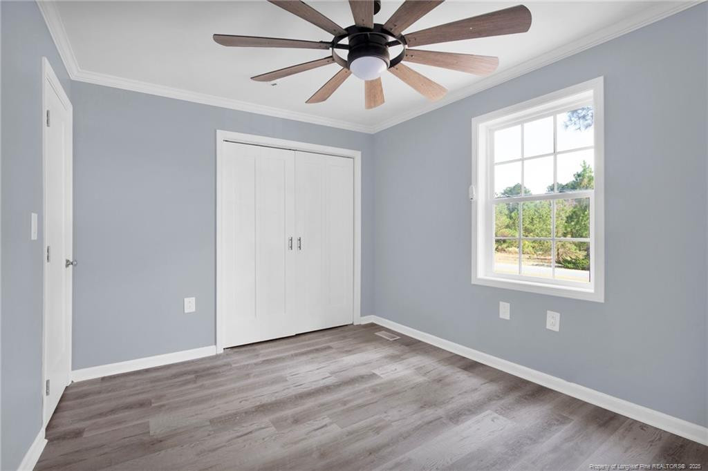 266 Brower Road Cameron, NC 28326 - Photo 21 of 26 wooden floor in an empty room with a window
