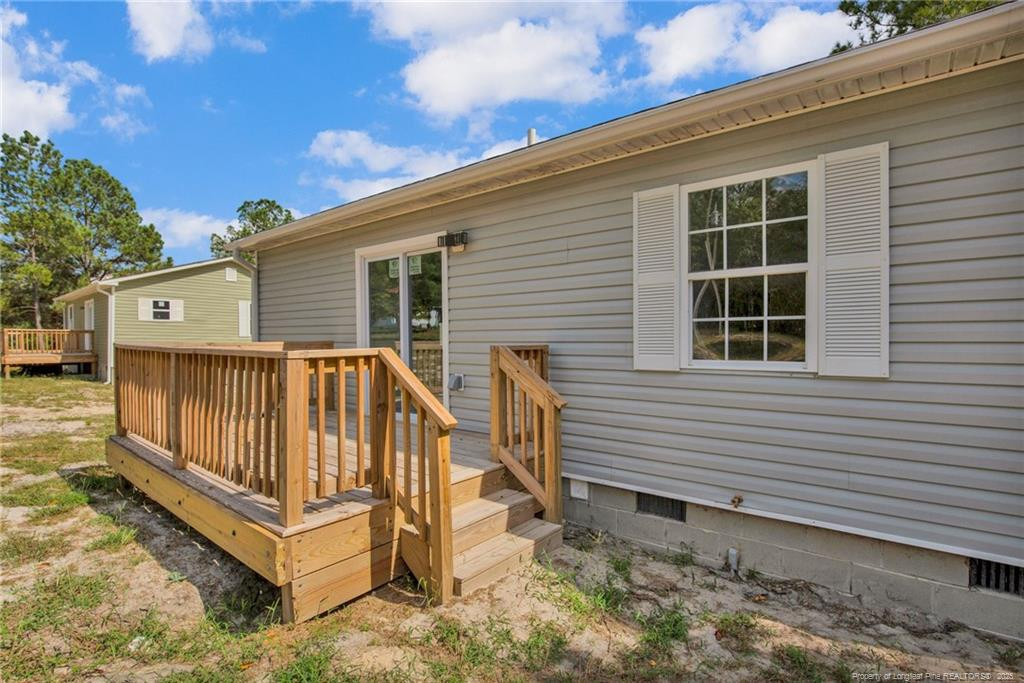 266 Brower Road Cameron, NC 28326 - Photo 7 of 26 a view of backyard with deck and outdoor seating
