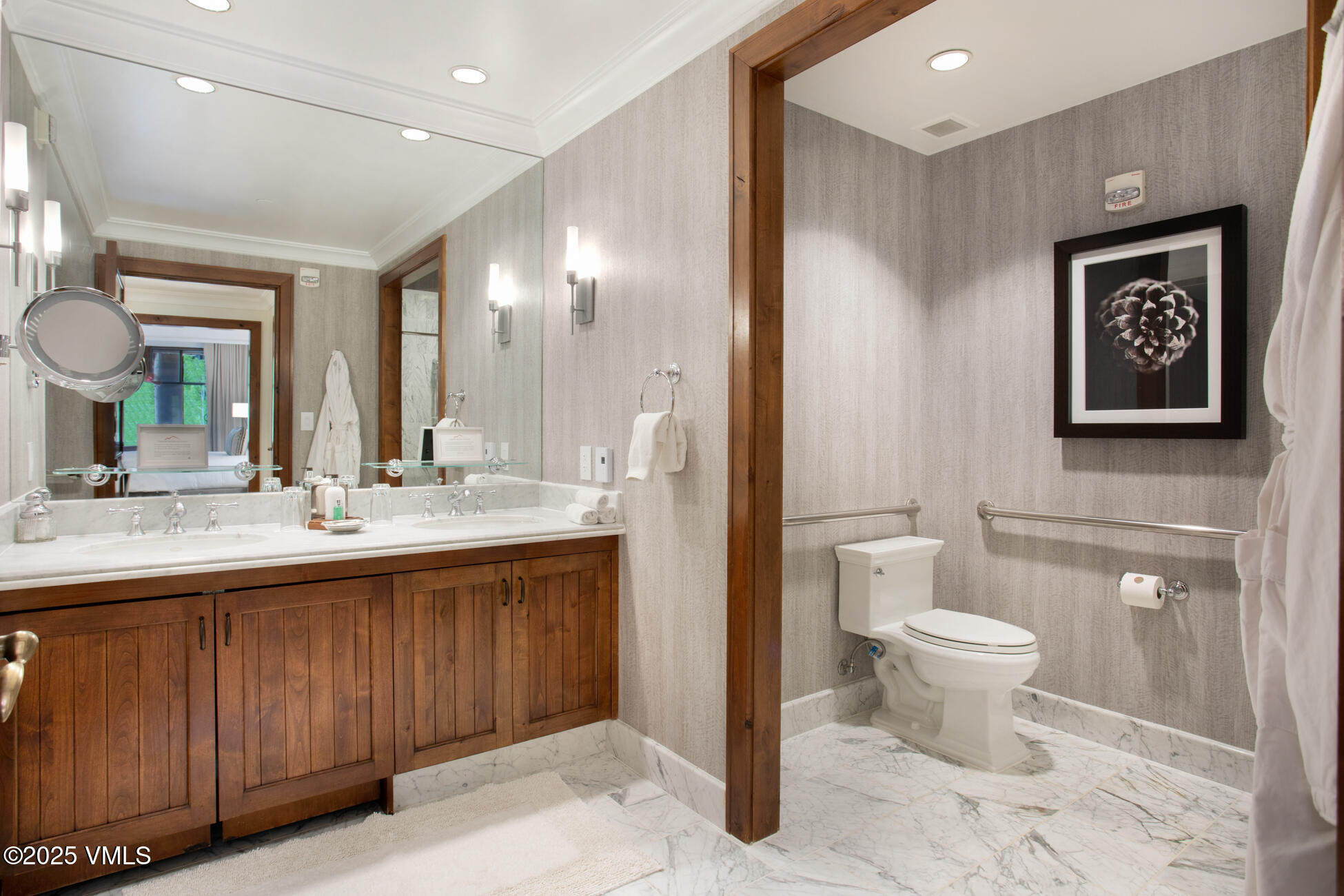 100 Bachelor Ridge Road, Unit 3414 Avon, CO 81620 - Photo 15 of 58 a bathroom with a toilet sink and mirror