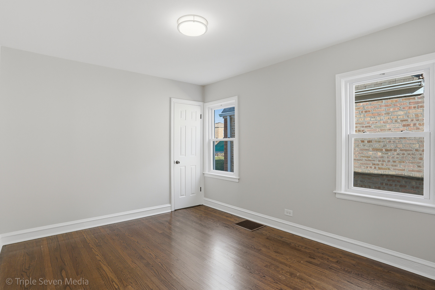 9149 South Aberdeen Street Chicago, IL 60620 - Photo 14 of 46 an empty room with wooden floor and window