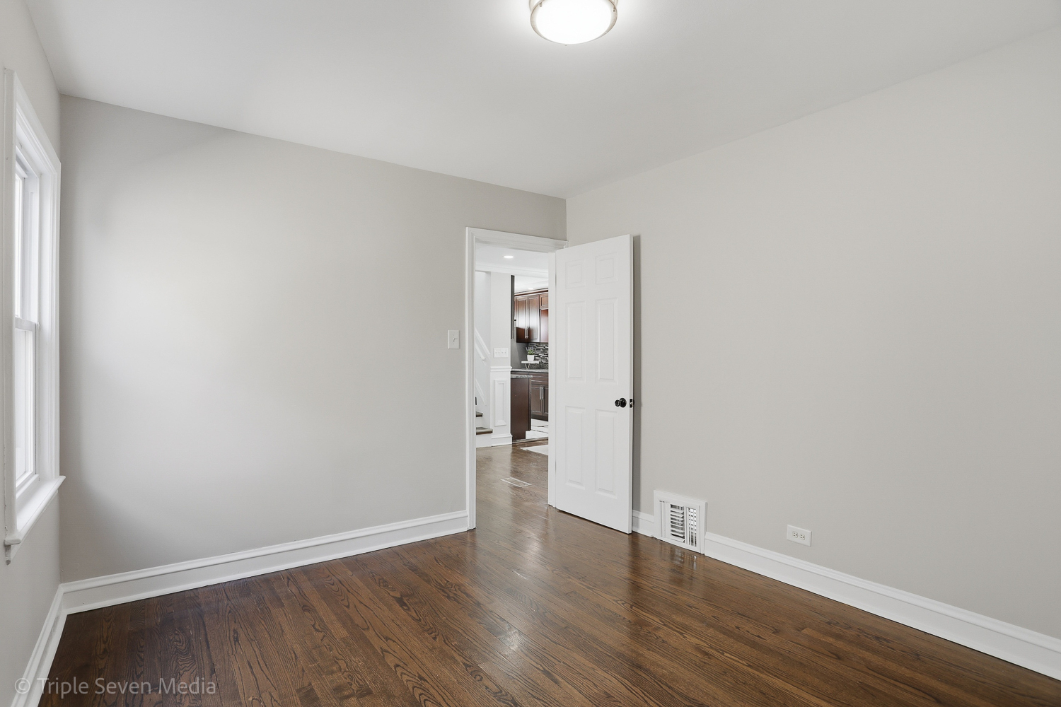 9149 South Aberdeen Street Chicago, IL 60620 - Photo 15 of 46 a view of an empty room and wooden floor