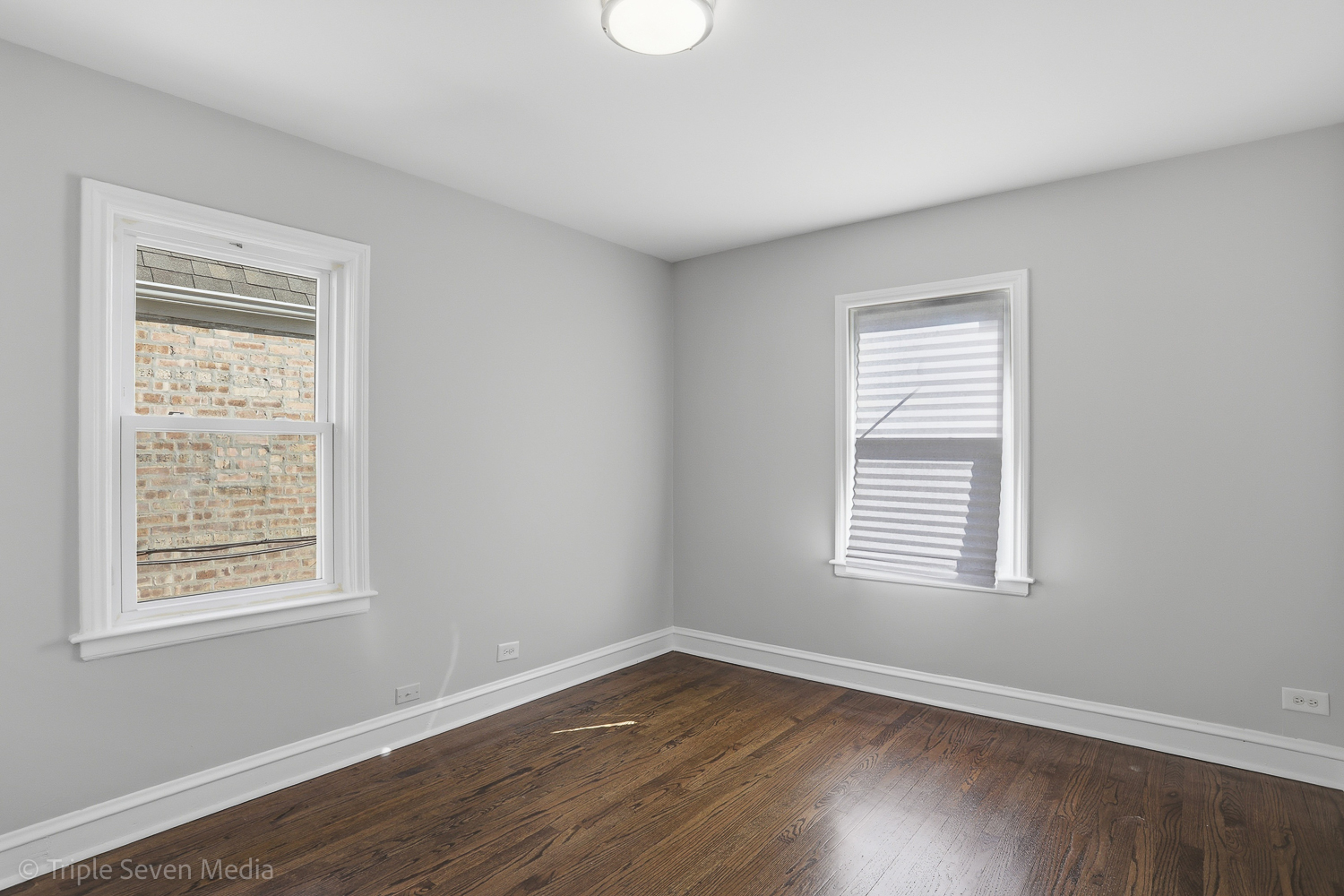 9149 South Aberdeen Street Chicago, IL 60620 - Photo 16 of 46 a view of an empty room with wooden floor and a window