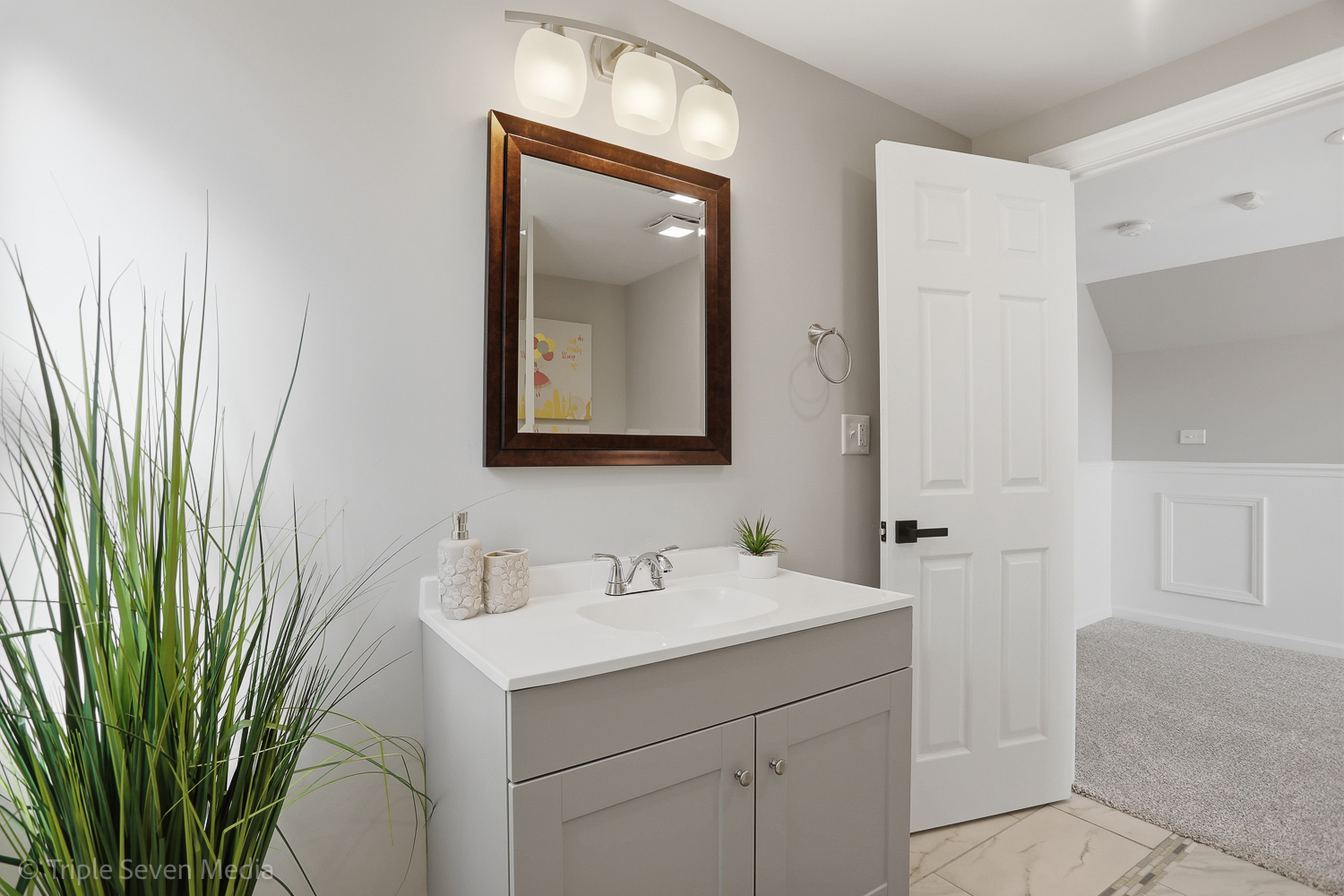 9149 South Aberdeen Street Chicago, IL 60620 - Photo 29 of 46 a bathroom with a sink a mirror and a shower