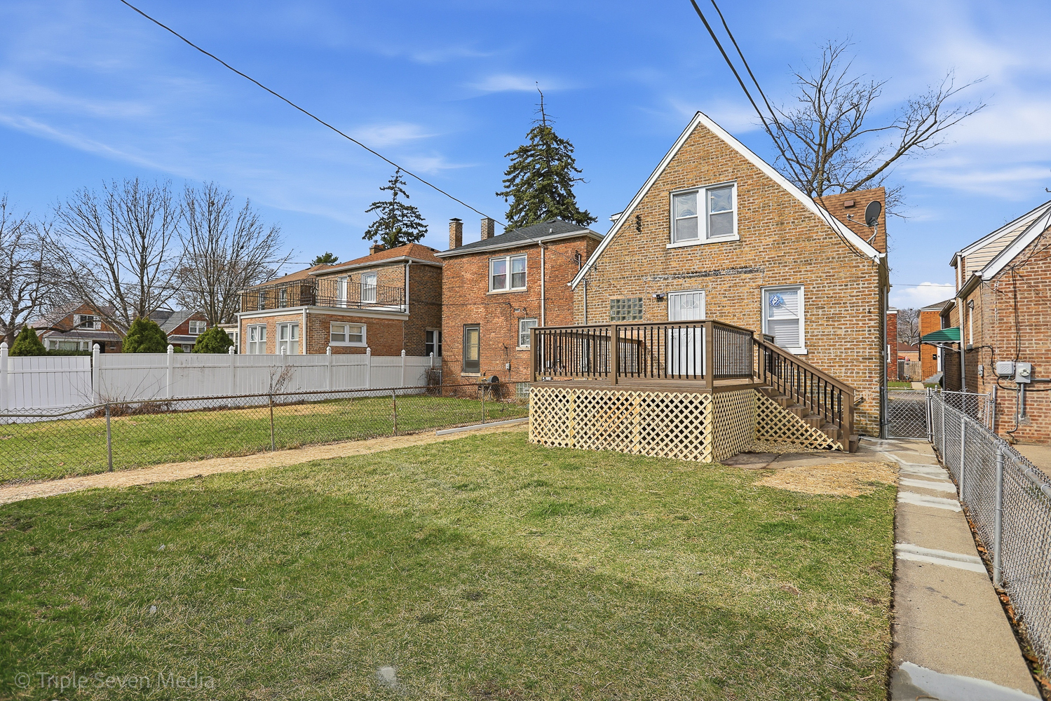 9149 South Aberdeen Street Chicago, IL 60620 - Photo 40 of 46 a view of a house with a yard