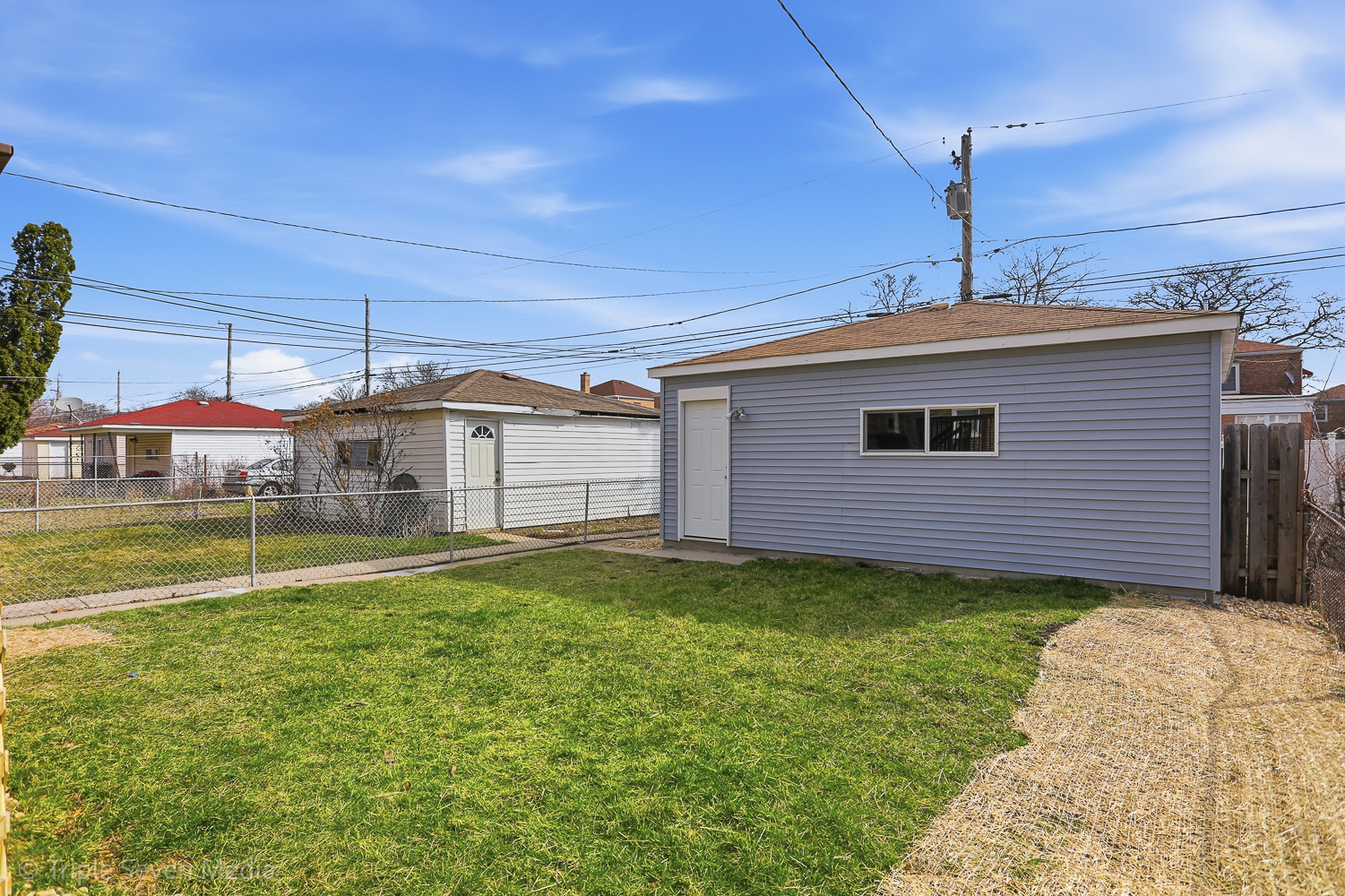 9149 South Aberdeen Street Chicago, IL 60620 - Photo 42 of 46 a view of a house with a tub and a yard