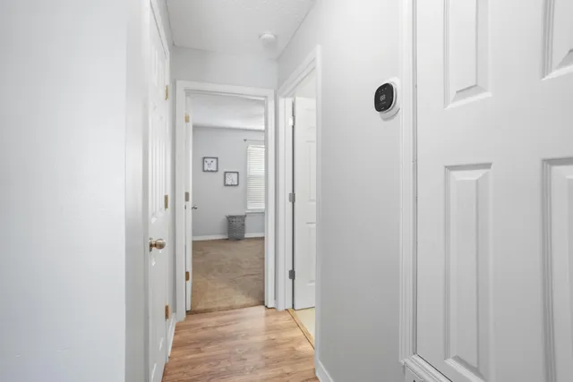 a view of a bathroom from a hallway