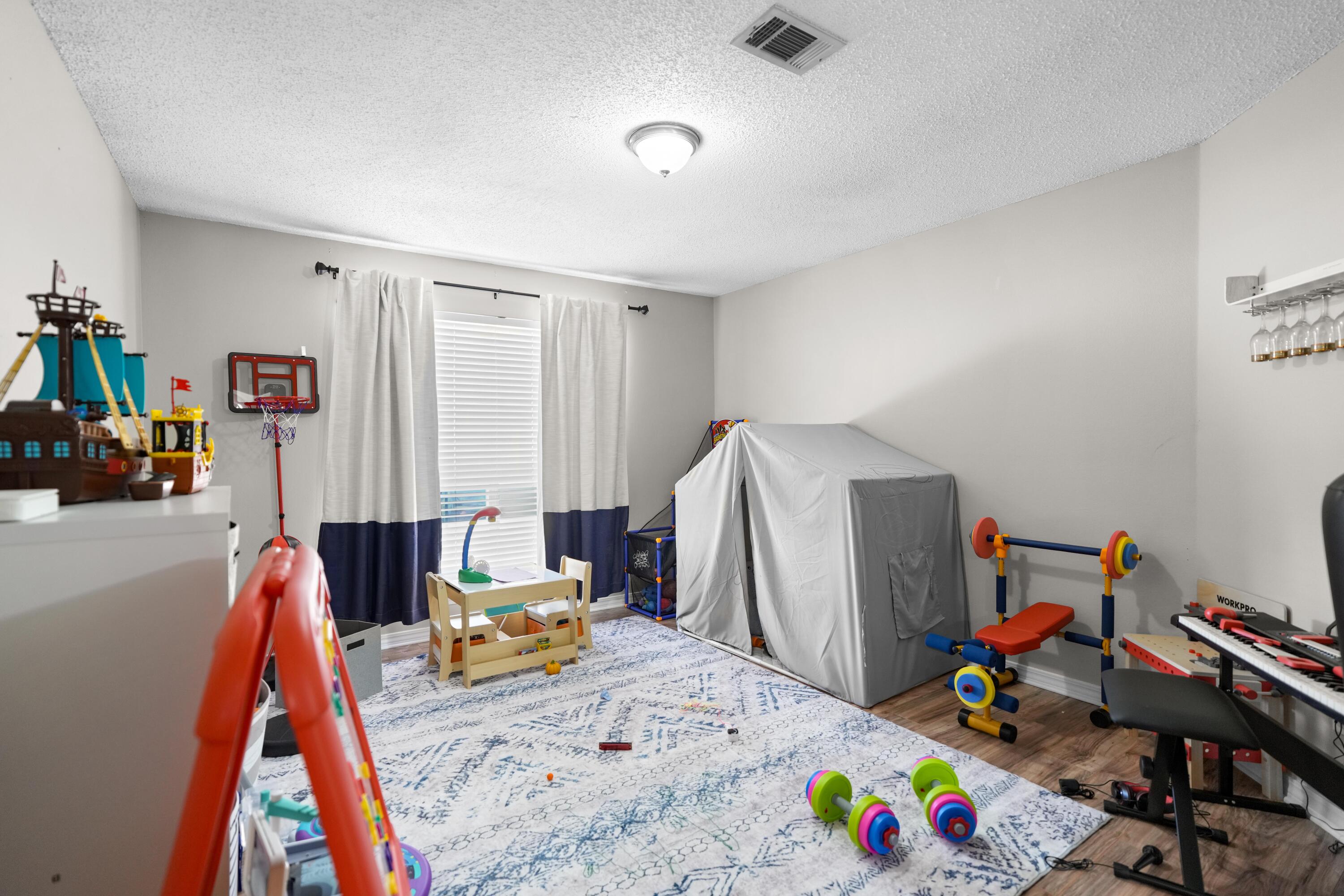 422 Jillian Drive Crestview, FL 32536 - Photo 13 of 26 a view of a room with toys and toys