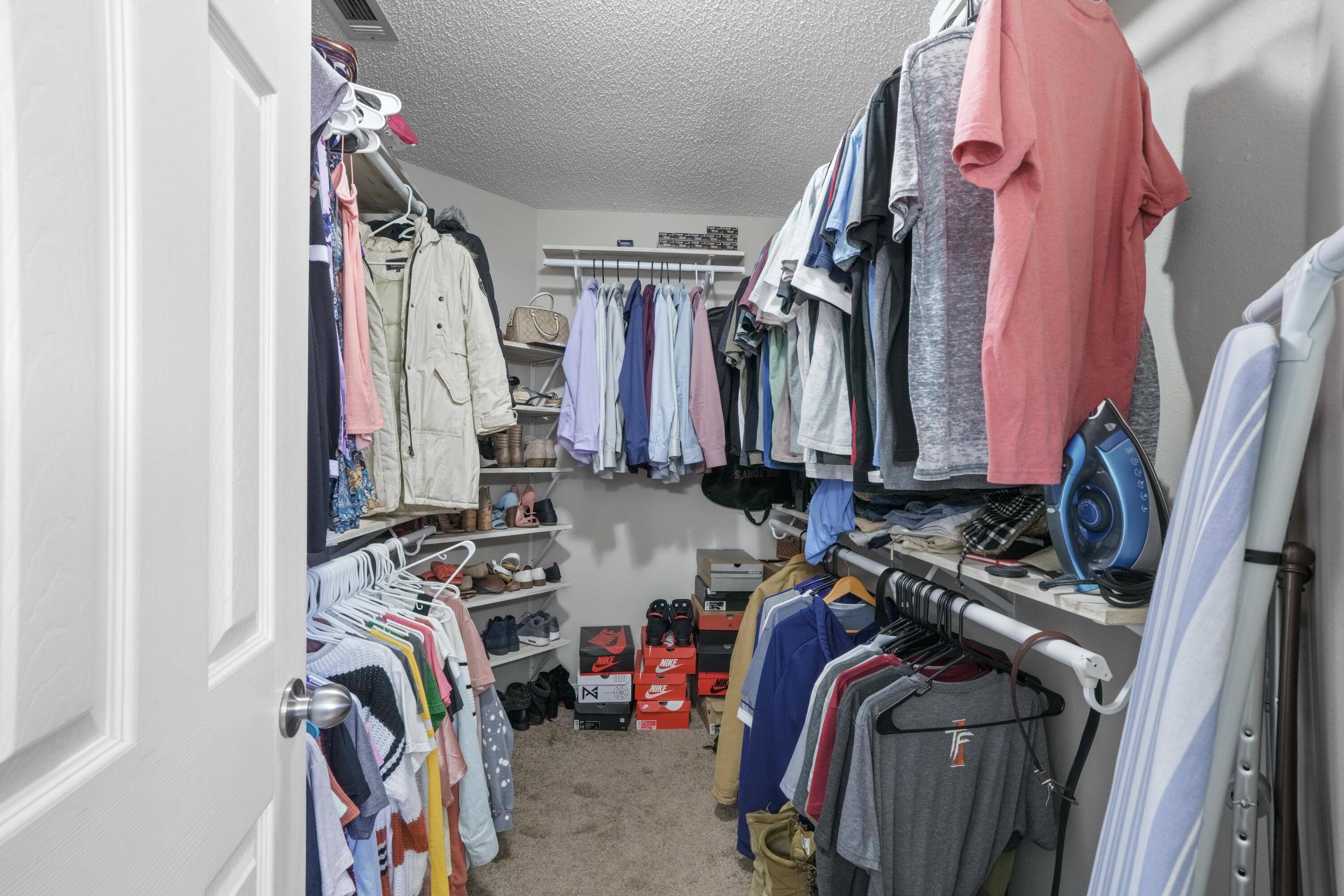 422 Jillian Drive Crestview, FL 32536 - Photo 22 of 26 a view of walk in closet with clothes