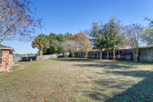 a view of a yard with a house