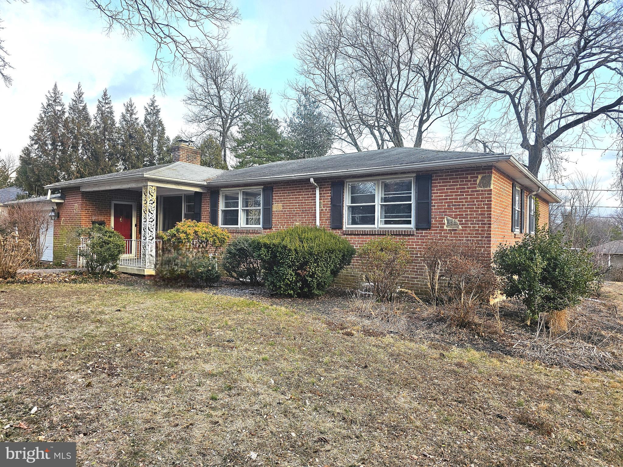 4404 Miller Road Wilmington, DE 19802 - Photo 2 of 17 a house that has a tree in front of it