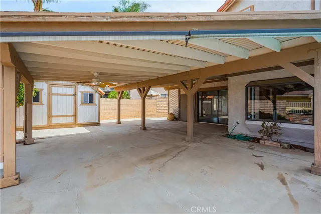 a yellow house with trees in front of it