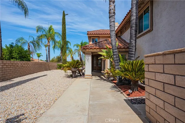 a view of a house with potted plants