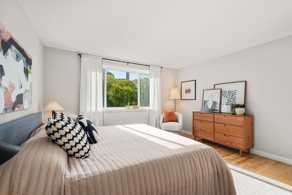 205 Kent Street, Unit 48 Brookline, MA 02446 - Photo 7 of 10 a bedroom with a bed and a window