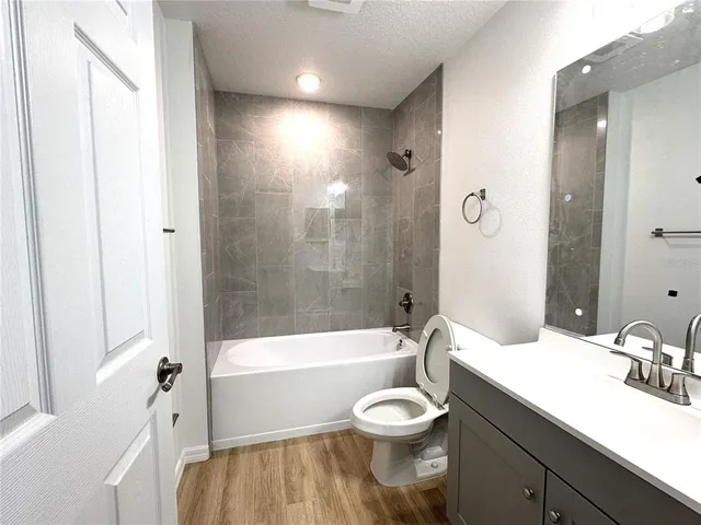 a bathroom with a sink a toilet and a bathtub