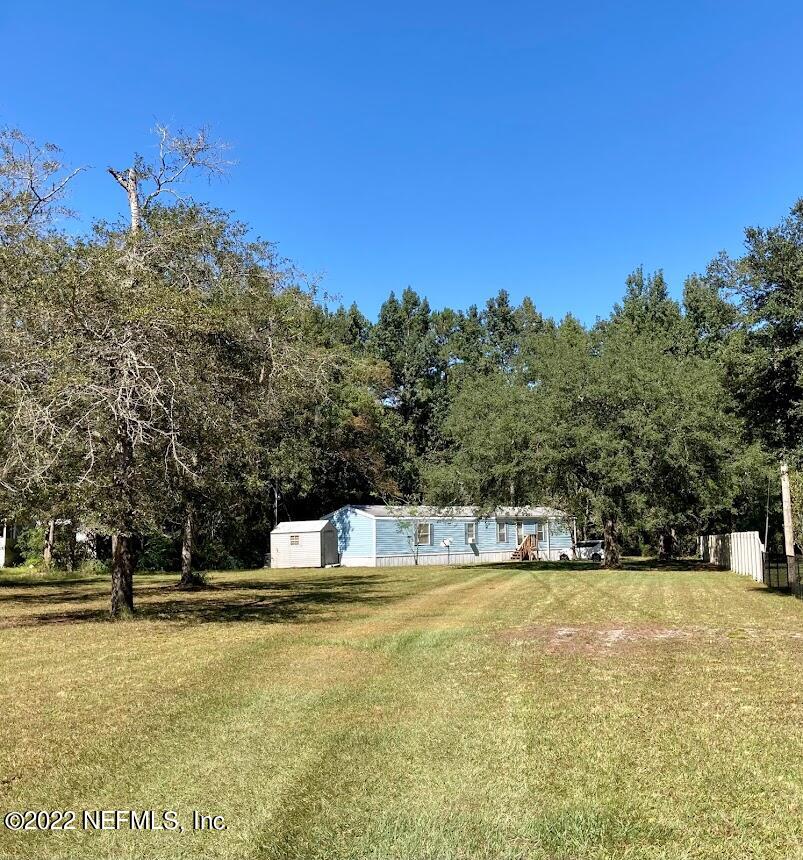 3265 Stratton Road Jacksonville, FL 32221 - Photo 1 of 13 a house view with swimming pool in front of it