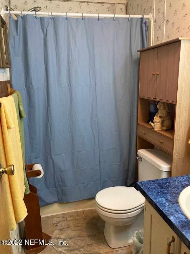 3265 Stratton Road Jacksonville, FL 32221 - Photo 11 of 13 a bathroom with a toilet and a shower