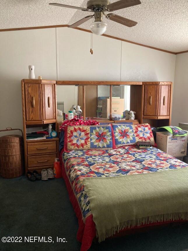 3265 Stratton Road Jacksonville, FL 32221 - Photo 5 of 13 a bed sitting in a bedroom next to a window