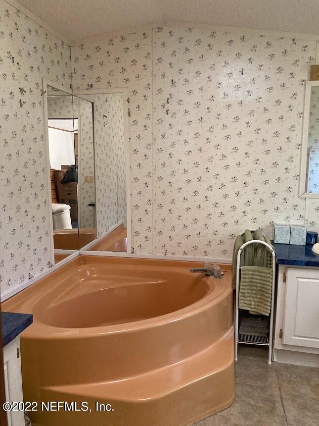 3265 Stratton Road Jacksonville, FL 32221 - Photo 6 of 13 a bathroom with a bathtub