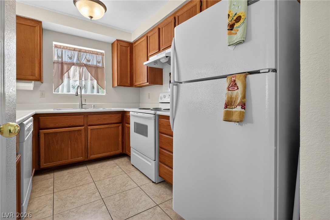 2241 Highpointe Drive, Unit 101 Laughlin, NV 89029 - Photo 10 of 23 This kitchen offers a practical layout and ample storage with classic wood cabinetry.
